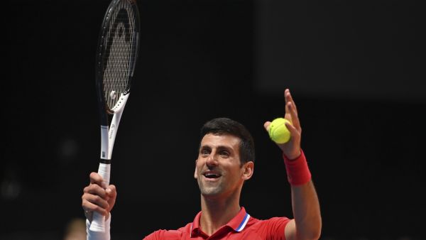 Serbia's Novak Djokovic celebrates defeating Austria's Sebastian Ofner during the 2022 World Tennis League exhibition match at Dubai’s Coca-Cola arena in the United Arab Emirates, on December 23, 2022. (Photo by Ryan LIM and Ryan LIM / AFP)