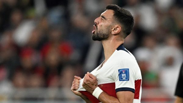 Portugal's midfielder #08 Bruno Fernandes reacts after missing a goal opportunity during the Qatar 2022 World Cup quarter-final football match between Morocco and Portugal at the Al-Thumama Stadium in Doha on December 10, 2022. (Photo by PATRICIA DE MELO MOREIRA / AFP)