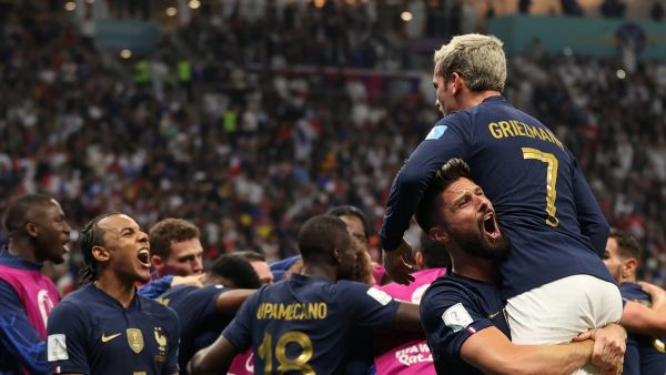 France's forward #09 Olivier Giroud celebrates scoring his team's second goal with teammate forward #07 Antoine Griezmann during the Qatar 2022 World Cup quarter-final football match between England and France at the Al-Bayt Stadium in Al Khor, north of Doha, on December 10, 2022. (Photo by ADRIAN DENNIS / AFP)