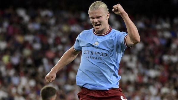 Manchester City's Norwegian striker Erling Haaland celebrates after scoring his team's third goal during the UEFA Champions League Group G first-leg football match between Sevilla FC and Manchester City, at the Ramon Sanchez Pizjuan stadium in Seville on September 6, 2022. (Photo by CRISTINA QUICLER / AFP)