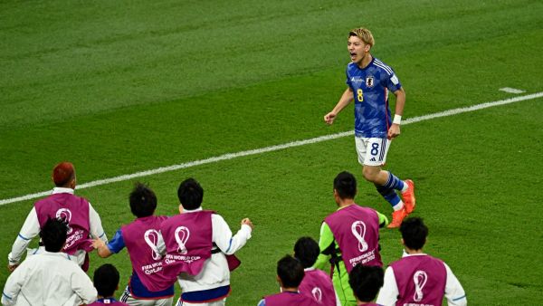 Japan's midfielder #08 Ritsu Doan celebrates scoring his team's first goal during the Qatar 2022 World Cup Group E football match between Japan and Spain at the Khalifa International Stadium in Doha on December 1, 2022. (Photo by Jewel SAMAD / AFP)