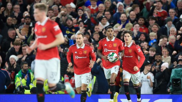 Manchester United's English striker Marcus Rashford (2R) celebrates scoring the team's second goal during the English League Cup third round football match between Manchester United and Aston Villa at Old Trafford in Manchester, north west England, on November 10, 2022. (Photo by Lindsey Parnaby / AFP)