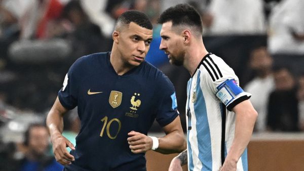 France's forward #10 Kylian Mbappe (L) gestures towards Argentina's forward #10 Lionel Messi (R) during the Qatar 2022 World Cup final football match between Argentina and France at Lusail Stadium in Lusail, north of Doha on December 18, 2022. (Photo by Anne-Christine POUJOULAT / AFP)