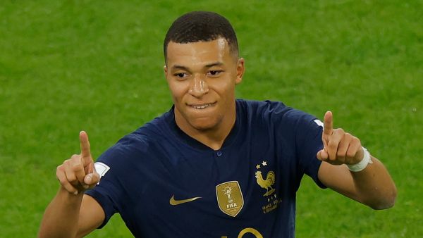 France's forward #10 Kylian Mbappe celebrates scoring his team's second goal during the Qatar 2022 World Cup round of 16 football match between France and Poland at the Al-Thumama Stadium in Doha on December 4, 2022. (Photo by Odd ANDERSEN / AFP)