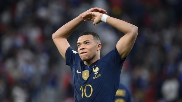 France's forward #10 Kylian Mbappe celebrates scoring his team's third goal during the Qatar 2022 World Cup round of 16 football match between France and Poland at the Al-Thumama Stadium in Doha on December 4, 2022. (Photo by FRANCK FIFE / AFP)