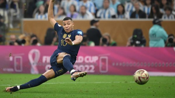 France's forward #10 Kylian Mbappe strikes the ball to score his team's second goal during the Qatar 2022 World Cup football final match between Argentina and France at Lusail Stadium in Lusail, north of Doha on December 18, 2022. (Photo by FRANCK FIFE / AFP)