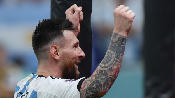 Argentina's forward #10 Lionel Messi celebrates after Argentina's forward #09 Julian Alvarez (unseen) scored his team's third goal during the Qatar 2022 World Cup football semi-final match between Argentina and Croatia at Lusail Stadium in Lusail, north of Doha on December 13, 2022. (Photo by Giuseppe CACACE / AFP)