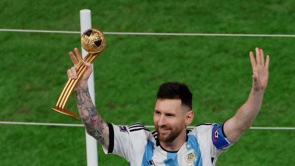 Argentina's forward #10 Lionel Messi gestures after receiving the Golden Ball award during the Qatar 2022 World Cup trophy ceremony after the football final match between Argentina and France at Lusail Stadium in Lusail, north of Doha on December 18, 2022. (Photo by Odd ANDERSEN / AFP)