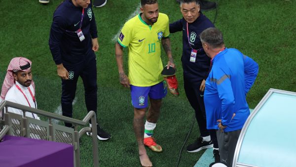 Brazil's forward #10 Neymar walks with a swollen ankle at the end of the Qatar 2022 World Cup Group G football match between Brazil and Serbia at the Lusail Stadium in Lusail, north of Doha on November 24, 2022. (Photo by Giuseppe CACACE / AFP)