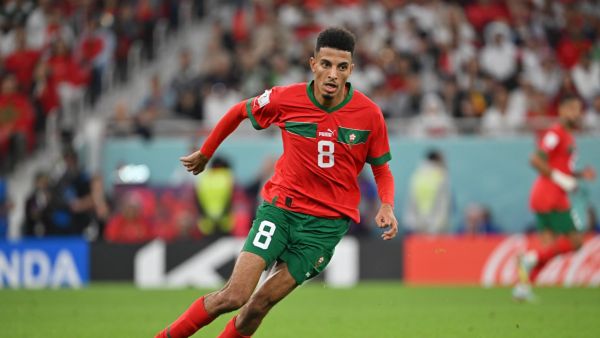 Morocco's midfielder #08 Azzedine Ounahi runs with the ball during the Qatar 2022 World Cup quarter-final football match between Morocco and Portugal at the Al-Thumama Stadium in Doha on December 10, 2022. (Photo by Alberto PIZZOLI / AFP)