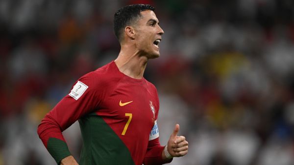 Portugal's forward #07 Cristiano Ronaldo speaks to teammates during the Qatar 2022 World Cup round of 16 football match between Portugal and Switzerland at Lusail Stadium in Lusail, north of Doha on December 6, 2022. (Photo by Paul ELLIS / AFP)