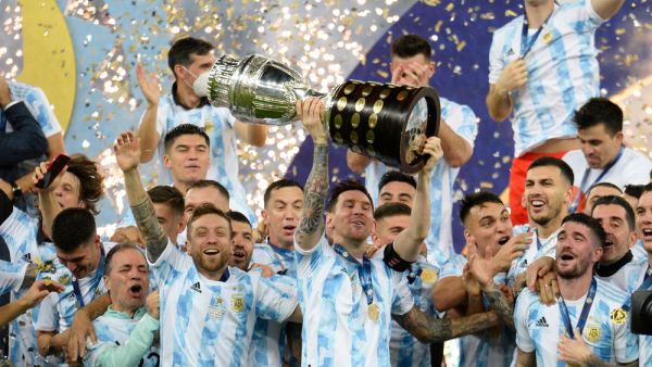 Argentina's Lionel Messi holds the trophy as he celebrates with teammates after beating 1-0 Brazil in the Copa America final. (Shutterstock/ file photo) World Cup