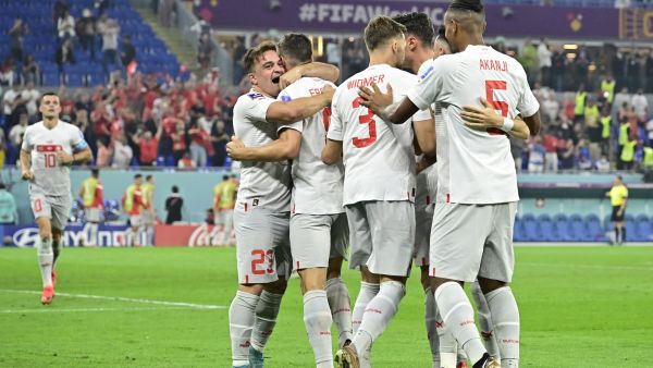 Switzerland's midfielder #08 Remo Freuler (2-L) celebrates with midfielder #23 Xherdan Shaqiri and other teammates after scoring his team's third goal during the Qatar 2022 World Cup Group G football match between Serbia and Switzerland at Stadium 974 in Doha on December 2, 2022. (Photo by JAVIER SORIANO / AFP)