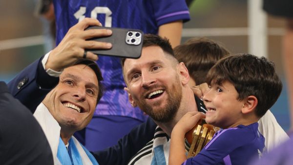 Argentina's captain and forward #10 Lionel Messi poses for a picture with Argentine former footballer Javier Zanetti after Argentina won the Qatar 2022 World Cup final football match between Argentina and France at Lusail Stadium in Lusail, north of Doha on December 18, 2022. (Photo by Adrian DENNIS / AFP)
