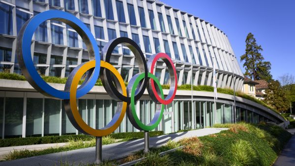 This photograph taken on September 8, 2022, shows the Olympic Rings during the opening of the executive board meeting of the International Olympic Committee (IOC), in front of the Olympic House, in Lausanne, Switzerland. (Photo by LAURENT GILLIERON / POOL / AFP)