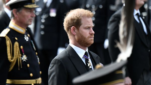 Britain's Prince Harry follows the coffin of Queen Elizabeth II. (Photo by STEPHANE DE SAKUTIN / POOL / AFP) Prince Harry