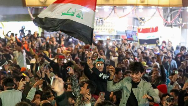 Iraq supporters celebrate their team's win in the Arabian Gulf Cup semi-final football match between Iraq and Qatar in the central holy shrine city of Najaf on January 16, 2023 (Photo by Asaad NIAZI / AFP) Arabian Gulf