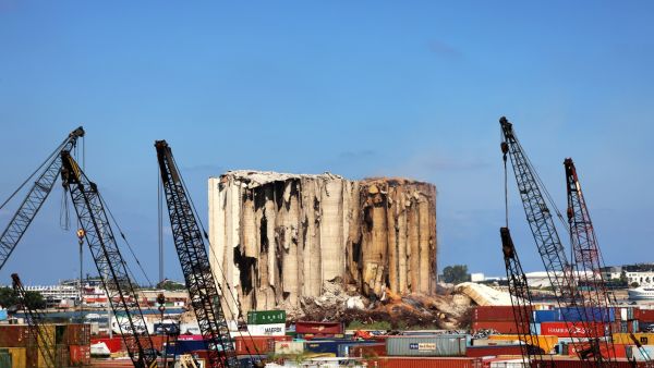 This file photo taken on August 12, 2022 shows a part of the middle grain silos in the port of Beirut which collapsed that week following the damage caused by the August 4, 2020 massive explosion that hit the Lebanese harbour.(Photo by JOSEPH EID / AFP) Beirut blast