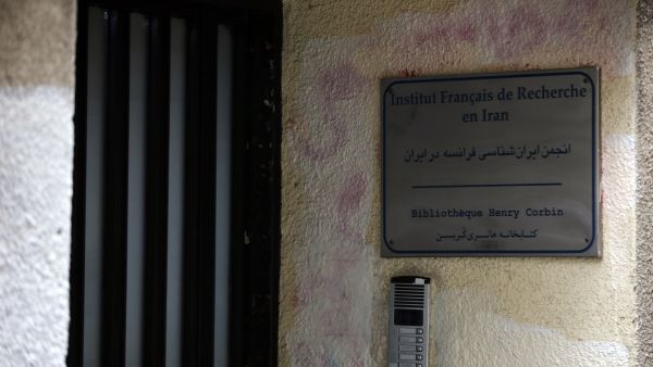 This picture shows the entrance of the French institute of research in the Iranian capital Tehran on January 5, 2023, after the authorities announced the closure of the establishment in protest against cartoons of the Islamic republic's supreme leader published by French satirical weekly Charlie Hebdo. The magazine printed the caricatures in support of months of protests in Iran as part of a special edition to mark the anniversary of the deadly 2015 attack on its Paris office which left 12 people dead, including some of its best known cartoonists. (Photo by AFP) French center in Iran