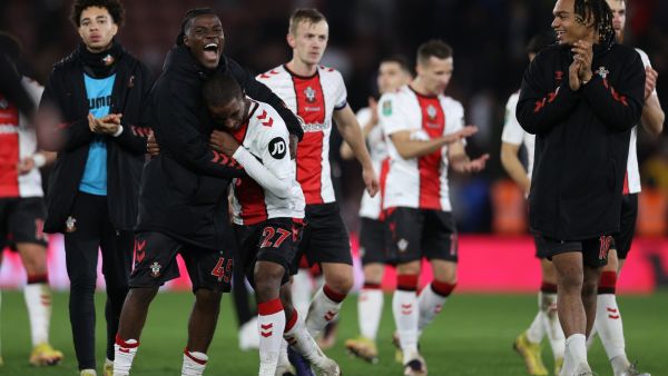Southampton's Belgian midfielder Romeo Lavia (2L) and Southampton's French midfielder Ibrahima Diallo (3L) celebrate with Southampton's French striker Sekou Mara (R) after the English League Cup quarter-final football match between Southampton and Manchester City at St Mary's Stadium in Southampton, southern England on January 11, 2023. - Southampton won the match 2-0. (Photo by ADRIAN DENNIS / AFP)