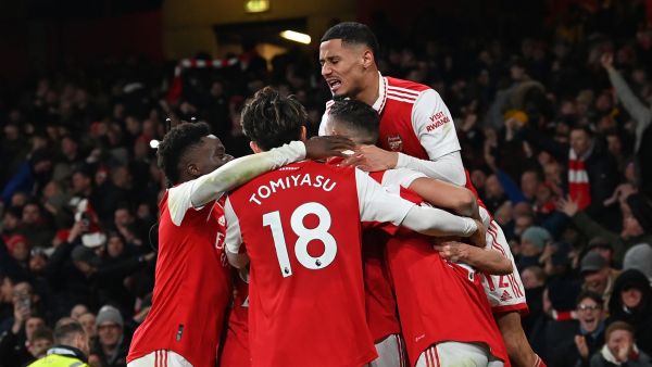 Arsenal's English striker Eddie Nketiah celebrates with teammates after scoring their third goal during the English Premier League football match between Arsenal and Manchester United at the Emirates Stadium in London on January 22, 2023. (Photo by Glyn KIRK / AFP)