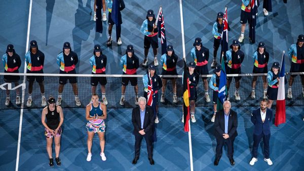 Winner Belarus' Aryna Sabalenka (2L) and Kazakhstan's Elena Rybakina (L) wait for the podium ceremony during the women's singles final on day thirteen of the Australian Open tennis tournament in Melbourne on January 28, 2023. (Photo by Paul CROCK / AFP)