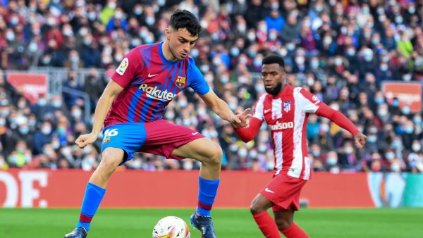 Barcelona's Spanish midfielder Pedri controls the ball during the Spanish league football match between FC Barcelona and Club Atletico de Madrid at the Camp Nou stadium in Barcelona on February 6, 2022. (Photo by LLUIS GENE / AFP)