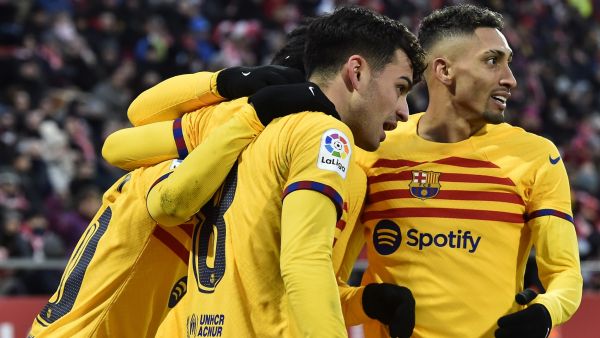 Barcelona's Spanish midfielder Pedri (2R) celebrates scoring the opening goal during the Spanish League football match between Girona FC and FC Barcelona at the Montilivi stadium in Girona on January 28, 2023. (Photo by Pau BARRENA / AFP)