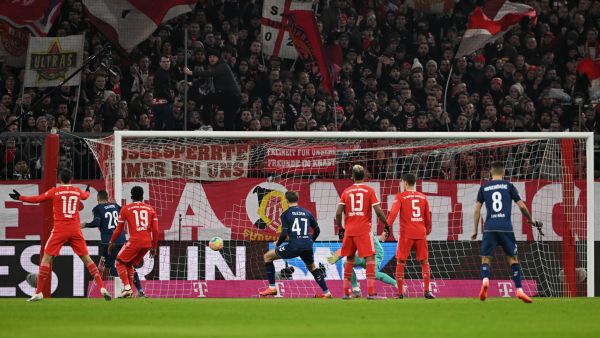 Cologne's Tunisian midfielder Ellyes Skhiri (2ndL) scores the opening goal during the German first division Bundesliga football match between Bayern Munich and FC Cologne in Munich, southern Germany, on January 24, 2023. (Photo by CHRISTOF STACHE / AFP) 