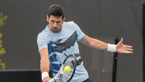 Serbian tennis player Novak Djokovic hits a return during a practice session ahead of the ATP Adelaide International tournament, in Adelaide on December 30, 2022. (Photo by Brenton EDWARDS / AFP)