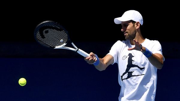 Serbia's Novak Djokovic hits a return during a practice session ahead of the Australian Open tennis tournament in Melbourne on January 14, 2023. (Photo by Paul CROCK / AFP)