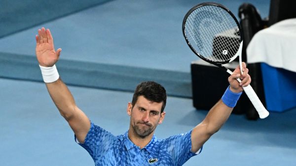 Serbia's Novak Djokovic celebrates after victory against Australia's Alex De Minaur during their men's singles match on day eight of the Australian Open tennis tournament in Melbourne on January 23, 2023. (Photo by WILLIAM WEST / AFP)