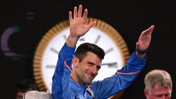 Serbia's Novak Djokovic waves as he leaves after victory against Tommy Paul of the US during their men's singles semi-final match on day twelve of the Australian Open tennis tournament in Melbourne on January 27, 2023. (Photo by WILLIAM WEST / AFP)