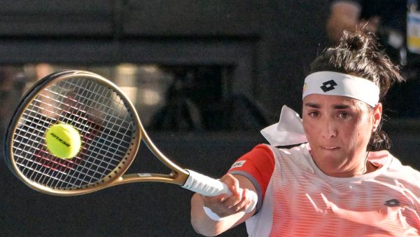 Tunisia's Ons Jabeur hits a return against Ukraine's Marta Kostyuk during their women's singles quarter-final match at the Adelaide International tennis tournament in Adelaide on January 6, 2023. (Photo by Brenton EDWARDS / AFP)