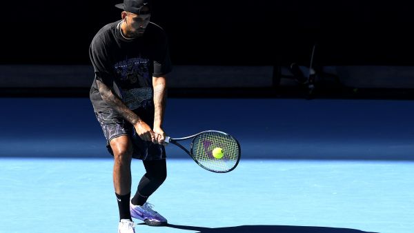 Australia's Nick Kyrgios hits a return during a practice session ahead of the Australian Open tennis tournament in Melbourne on January 14, 2023. (Photo by Paul CROCK / AFP)