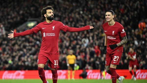 Liverpool's Egyptian striker Mohamed Salah (L) celebrates scoring his team's second goal during the English FA Cup third round football match between Liverpool and Wolverhampton Wanderers at Anfield in Liverpool, north-west England on January 7, 2023. (Photo by Oli SCARFF / AFP)