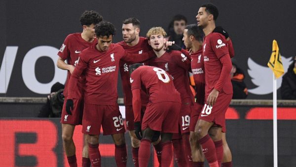 Liverpool's English midfielder Harvey Elliott (rear C) celebrates after scoring his team first goal during the FA Cup third round football match between Wolverhampton Wanderers and Liverpool FC at the Molineux stadium in Wolverhampton, central England on January 17, 2023. (Photo by Oli SCARFF / AFP)