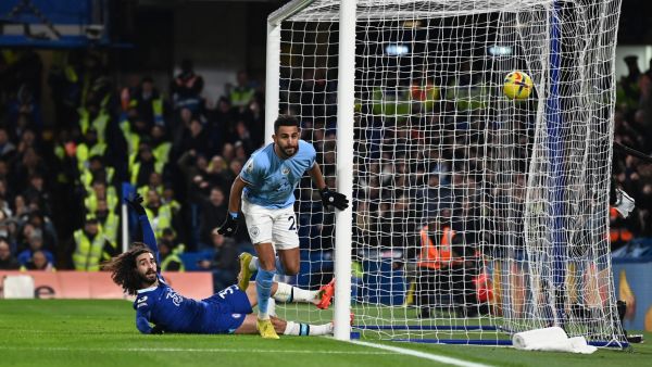Manchester City's Algerian midfielder Riyad Mahrez celebrates scoring the opening goal during the English Premier League football match between Chelsea and Manchester City at Stamford Bridge in London on January 5, 2023. (Photo by Glyn KIRK / IKIMAGES / AFP)