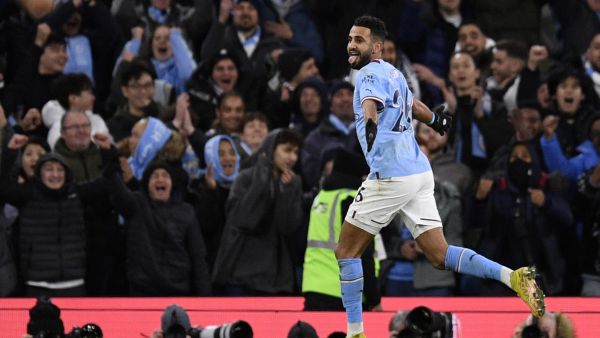 Manchester City's Algerian midfielder Riyad Mahrez celebrates scoring the team's fourth goal during the English Premier League football match between Manchester City and Tottenham Hotspur at the Etihad Stadium in Manchester, north west England, on January 19, 2023. (Photo by Oli SCARFF / AFP)