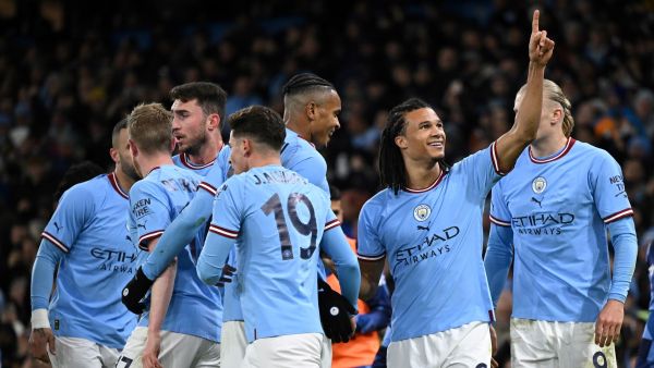 Manchester City's Dutch defender Nathan Ake (2ndR) celebrates with teammates after scoring their opening goal during the English FA Cup fourth round football match between Manchester City and Arsenal at the Etihad Stadium in Manchester, northwest England, on January 27, 2023. (Photo by Oli SCARFF / AFP)