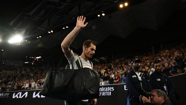 Britain's Andy Murray waves as he leaves after losing to Spain's Roberto Bautista Agut during their men's singles match on day six of the Australian Open tennis tournament in Melbourne on January 21, 2023. (Photo by WILLIAM WEST / AFP)