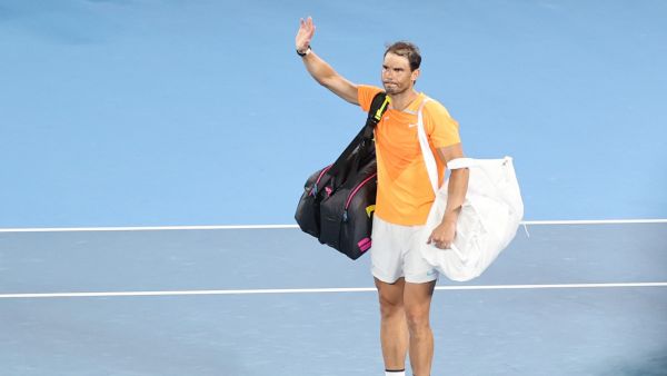 Spain's Rafael Nadal waves as he leaves after his men's singles against Mackenzie McDonald of the US on day three of the Australian Open tennis tournament in Melbourne on January 18, 2023. Defending champion and top seed Rafael Nadal crashed out of the Australian Open in round two to 65th-ranked American Mackenzie McDonald in a major upset Wednesday, his worst Grand Slam result in seven years. (Photo by Martin KEEP / AFP)