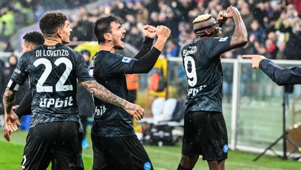 Napoli's Macedonian midfielder Eljif Elmas (C) celebrates with Napoli's Italian defender Giovanni Di Lorenzo (L) and Napoli's Nigerian forward Victor Osimhen after scoring a penalty during the Italian Serie A football match between Sampdoria and Napoli on January 8, 2023 at the Luigi-Ferraris stadium in Genoa. (Photo by Andreas SOLARO / AFP)
