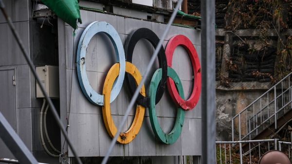 In this picture taken on November 20, 2022, the Olympic rings are pictured at the Okurayama Ski Jump Stadium in Sapporo. Sapporo is viewed as a leading contender for the 2030 Winter Olympics but is likely to face rival bids from other previous Olympic hosts such as Salt Lake City and Vancouver. (Photo by Yuichi YAMAZAKI / AFP)