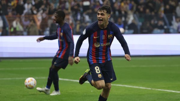 Barcelona's Spanish midfielder Pedri celebrates after scoring his team's third goal during the Spanish Super Cup final football match between Real Madrid CF and FC Barcelona at the King Fahd International Stadium in Riyadh, Saudi Arabia, on January 15, 2023. (Photo by Giuseppe CACACE / AFP)