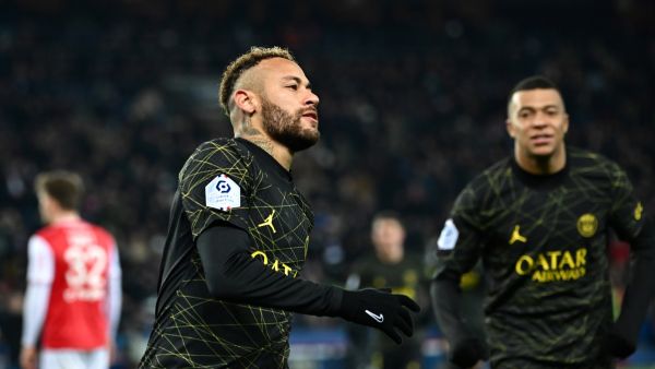 Paris Saint-Germain's Brazilian forward Neymar celebrates after scoring the opening goal during the French L1 football match between Paris Saint-Germain (PSG) and Stade de Reims at the Parc des Princes stadium in Paris on January 29, 2023. (Photo by Anne-Christine POUJOULAT / AFP)