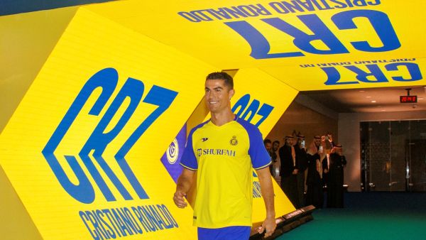 Al-Nassr's new Portuguese forward Cristiano Ronaldo entering the pitch during his unveiling ceremony at the Mrsool Park Stadium in the Saudi capital Riyadh on January 3, 2023. (Photo by Jorge Ferrari / Al Nassr Football Club / AFP)