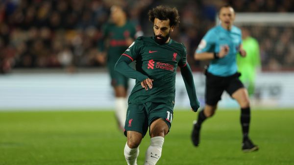 Liverpool's Egyptian striker Mohamed Salah plays a pass during the English Premier League football match between Brentford and Liverpool at Gtech Community Stadium in London on January 2, 2023. (Photo by Adrian DENNIS / AFP) 