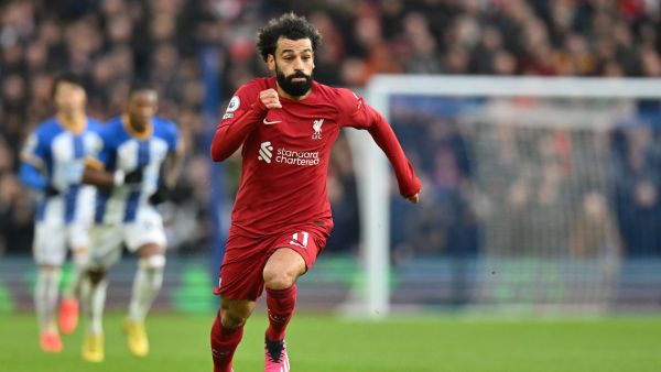 Liverpool's Egyptian striker Mohamed Salah runs with the ball during the English Premier League football match between Brighton and Hove Albion and Liverpool at the American Express Community Stadium in Brighton, southern England on January 14, 2023. (Photo by Glyn KIRK / AFP)