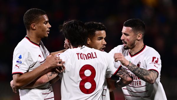 AC Milan's Brazilian forward Junior Messias (C-R) celebrates with AC Milan's Italian midfielder Sandro Tonali (C-L), AC Milan's Bosnian midfielder Rade Krunic (R) and AC Milan's German-Finnish defender Malick Thiaw after opening the scoring during the Italian Serie A football match between Monza and AC Milan on February 18, 2023 at the Brianteo stadium in Monza. (Photo by Marco BERTORELLO / AFP)